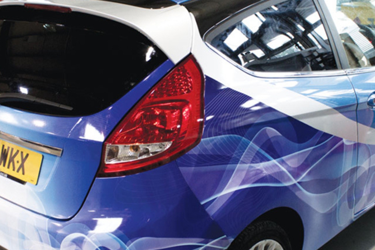 The rear quarter of a car wrapped in blue and white film printed on a Mimaki CJV300-160plus