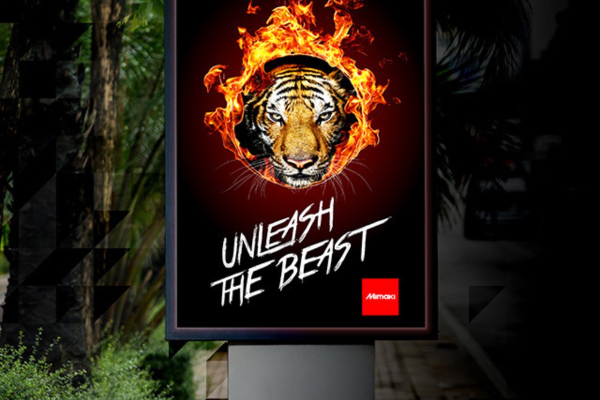 Am impactful backlit sign showing a flaming tiger motif in front of a leafy backdrop, printed by a Mimaki JV100-160 solvent printer