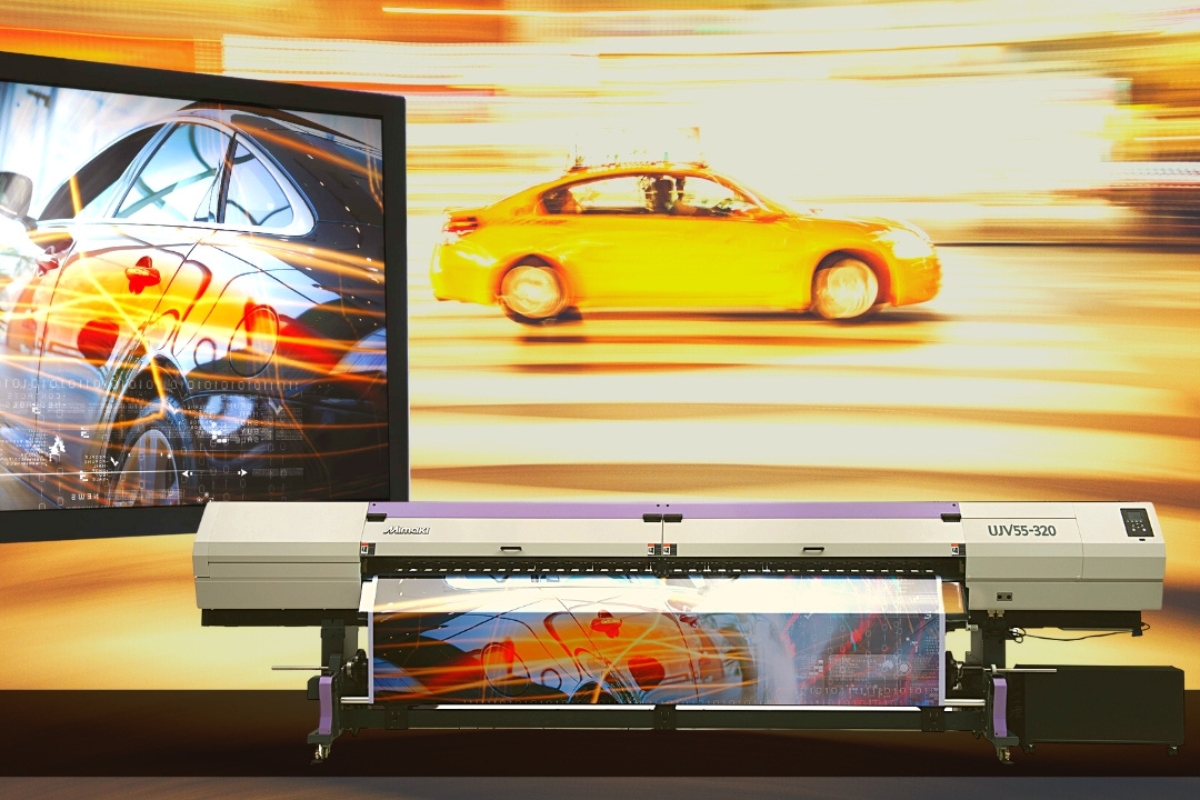 A backlit display sitting above and behind a Mimaki UJV55-320 3.2m superwide UV printer