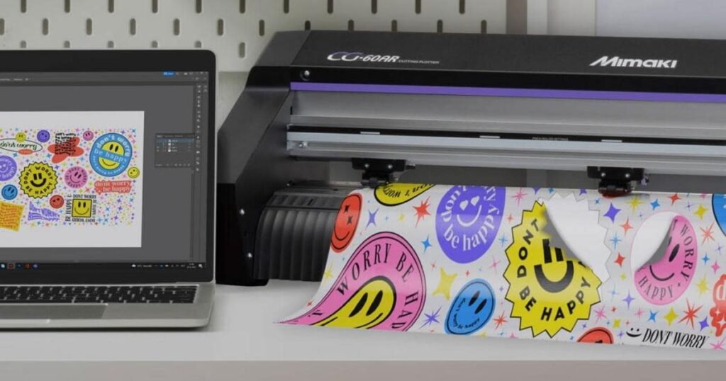 Mimaki CG-AR desktop cutter next to a laptop