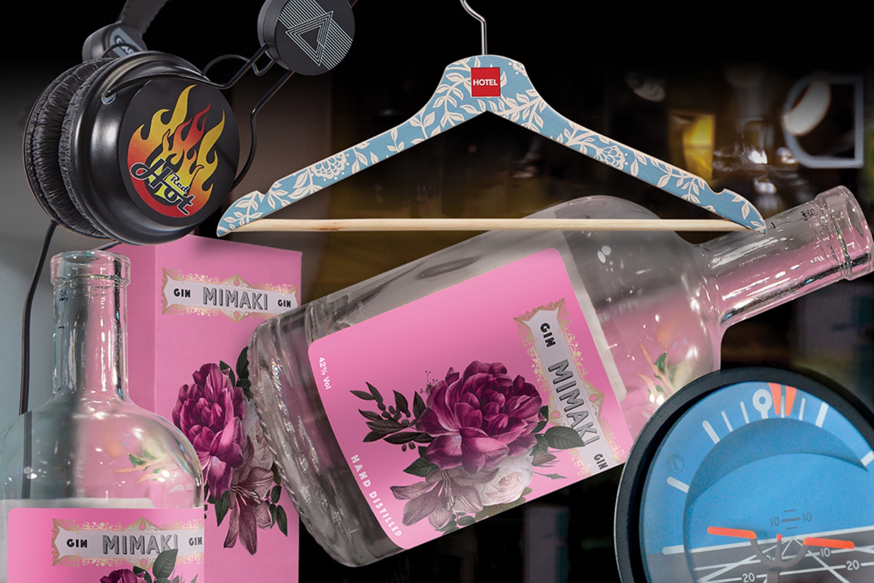 A printed wooden coat hanger, gine bottle, package, headphones and dial - all produced with Mimaki UV printing technology
