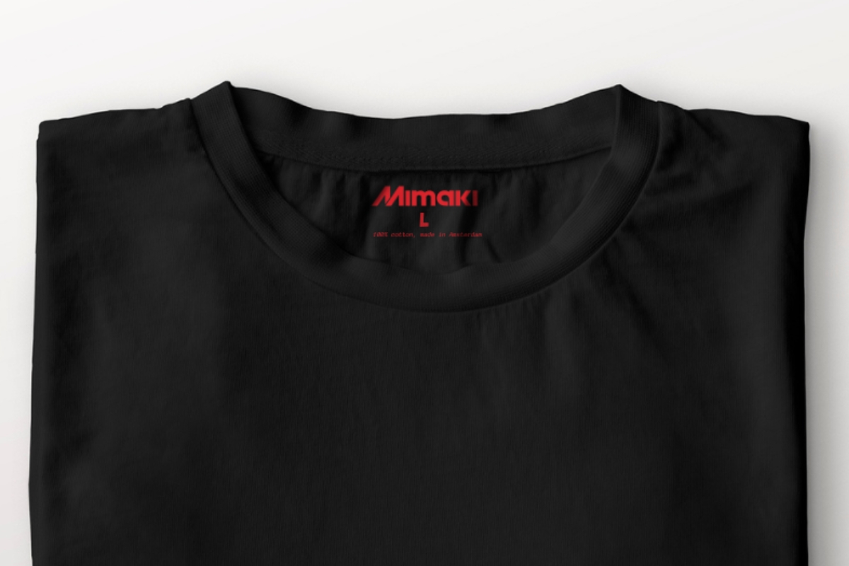 A black tshirt showing a DTF printed internal label