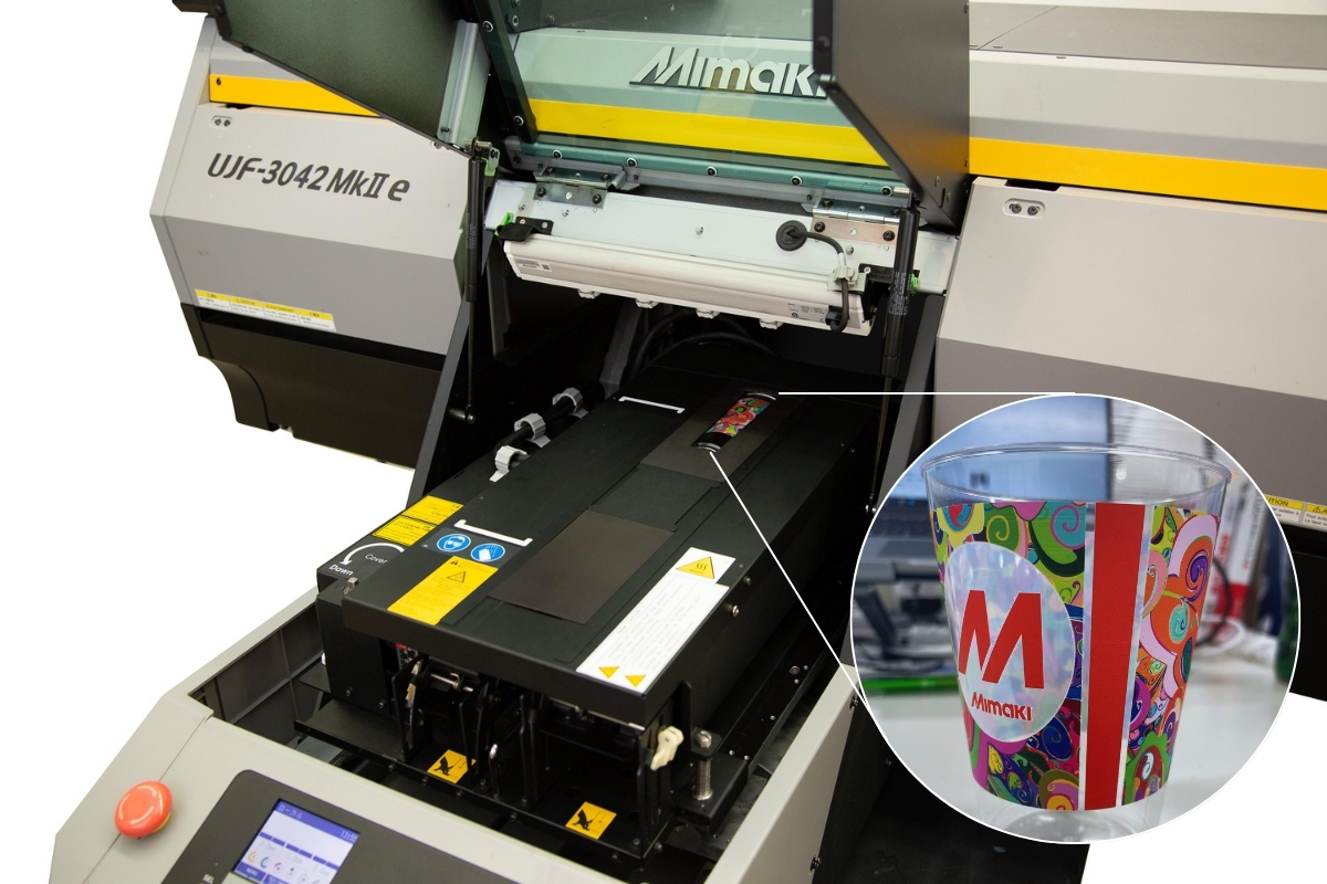 Mimaki UJF MkII e flatbed UV printer showing the optional Kebab HS attachment printing to a tapered glass