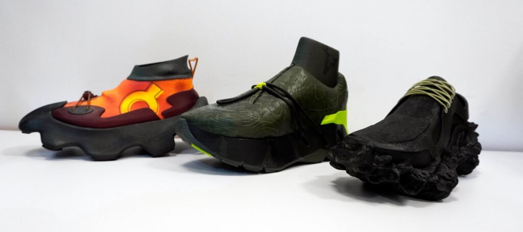 Three shoes showcasing designs created in Adobe Substance and printed on the Mimaki 3DUJ-53 full colour 3D printer