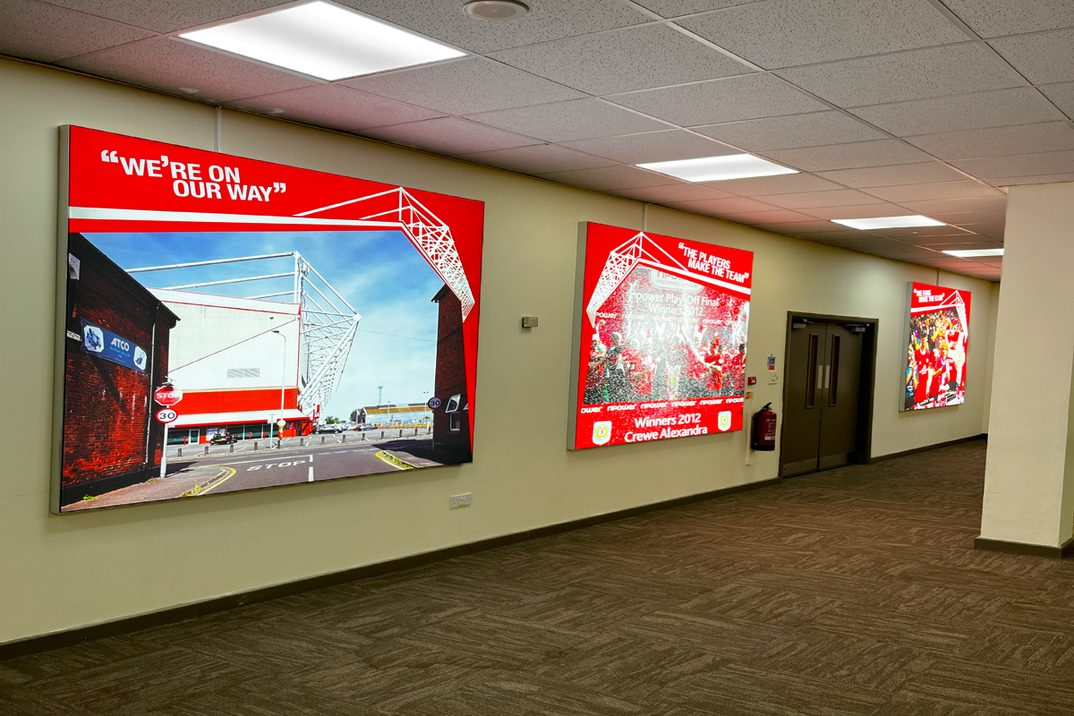 Large lightboxes feature wall with Crewe Alexandra related images.