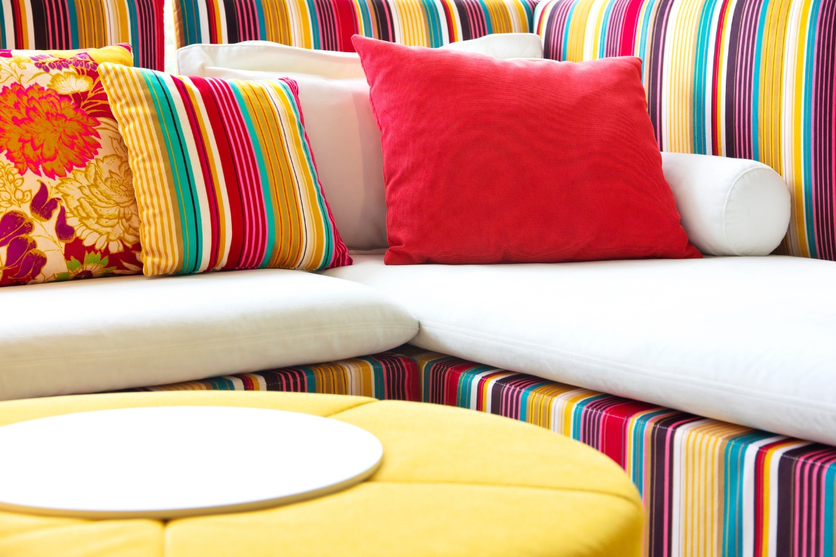 Brightly coloured printed upholstery and cushions